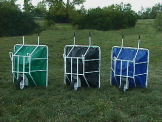 Three EquiGym Muck Carts standing upright, rear view