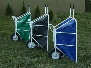 Three EquiGym Wheel Barrows standing upright in field